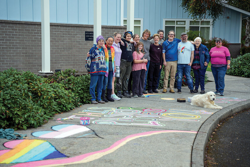 Participants helped decorate the pavement with affirmations, despite the rain, during Battle Ground Community United Methodist Church&rsquo;s &ldquo;Chalk the Walk&rdquo; on Saturday, Oct. 11.