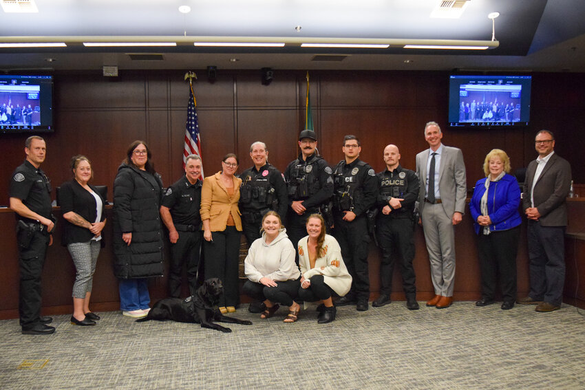 Jill Karmy stands with local police officers and city officials from Clark County cities after receiving a proclamation Oct. 20 at the Battle Ground City Council meeting. Karmy, who has prosecuted for several north county cities, will begin her new role as a Cowlitz County Superior Court judge on Nov. 1.