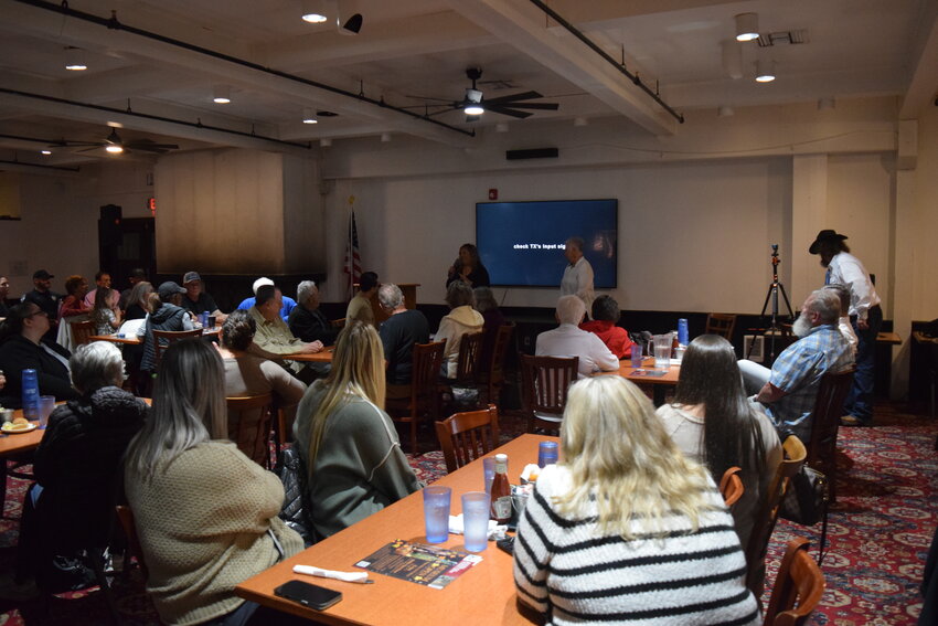 Audience members listen as Woodland City Council candidates Carol Rounds and Brittny Michaelson discuss local issues during the Oct. 21 forum at the Oak Tree Restaurant.