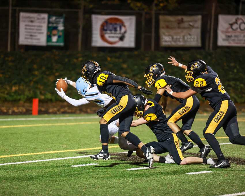 Hockinson&rsquo;s Jack Robinson reaches across the goal line after breaking multiple tackles during a running play to give the Hawks a wider lead in the 34-12 win over the Hudson&rsquo;s Bay Eagles on Thursday, Oct. 23.