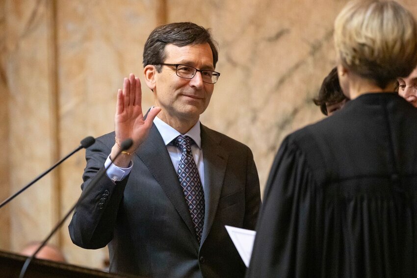 Bob Ferguson is sworn in as the 24th Governor of the State of Washington during his inauguration ceremony Wednesday, Jan. 15, 2025, at the Washington State Capitol in Olympia, Wash. (Photo by Ryan Berry/Washington State Standard)