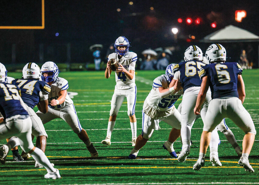 La Center junior quarterback Jett Johnson takes the snap in the fourth quarter of the Wildcats&rsquo; 12-7 loss to the Seton Catholic Cougars on Friday, Oct. 31.