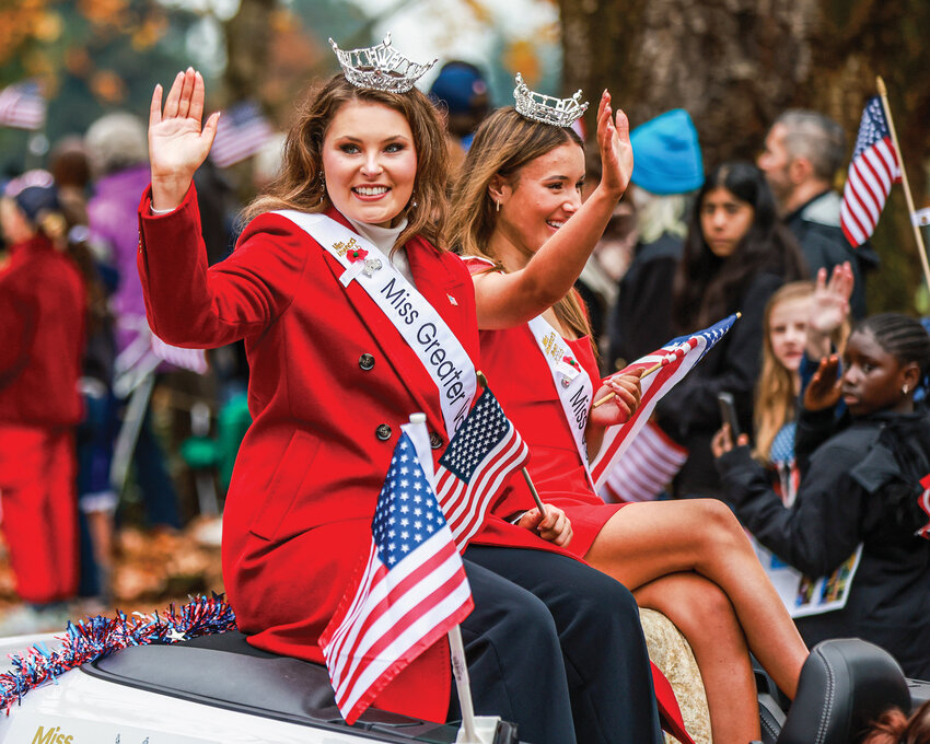 Natalie Worthy, left, the newly crowned Miss Greater Vancouver 2026, rides in the 37th annual Lough legacy Veterans Day Parade at the Fort Vancouver National Historic Site on Tuesday, Nov. 11.