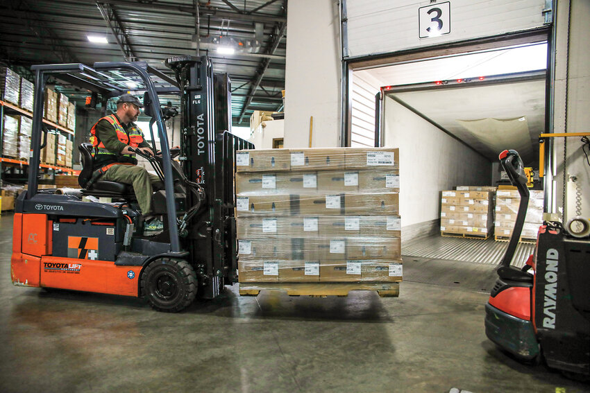 Clark County Food Bank Food and Warehouse Director Kieran Collins pulls a pallet of meat from a semi-truck as the Church of Jesus Christ of Latter-day Saints donated over a thousand cases of freshly frozen pork, beef roast and ground beef to the food bank on Thursday, Nov. 13.