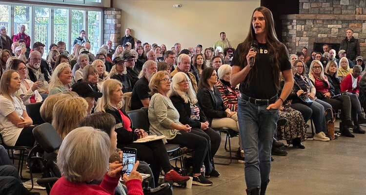 Scott Presler, a conservative activist now known for registering Republicans to vote, fires up a crown in Battle Ground on Monday.
