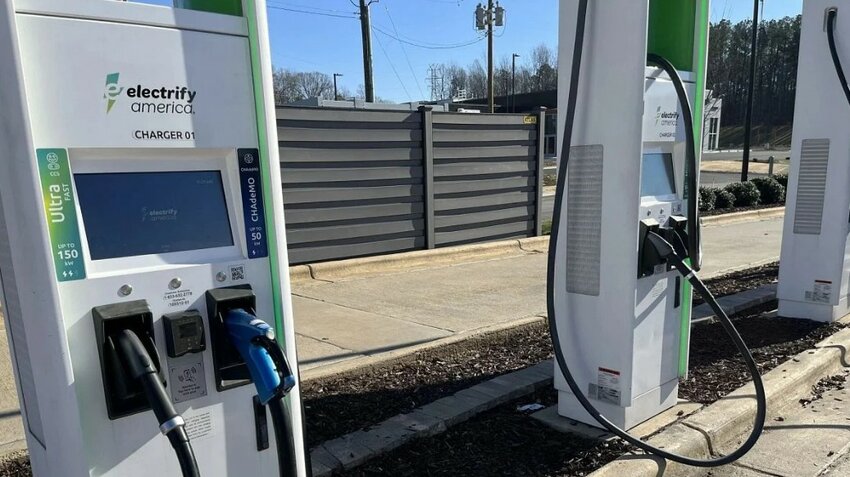 Electric vehicle charging stations are seen at a Sheetz in Hillsborough, N.C., Dec. 29, 2023.
