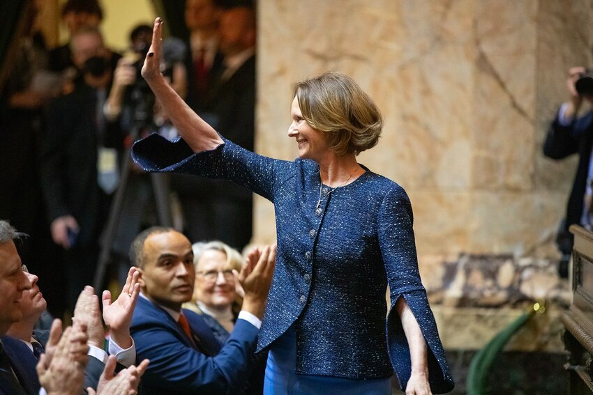 Insurance Commissioner Patty Kuderer waves to the room after being announced during the governor&rsquo;s inauguration Wednesday, Jan. 15, 2025, at the Washington State Capitol in Olympia, Wash.