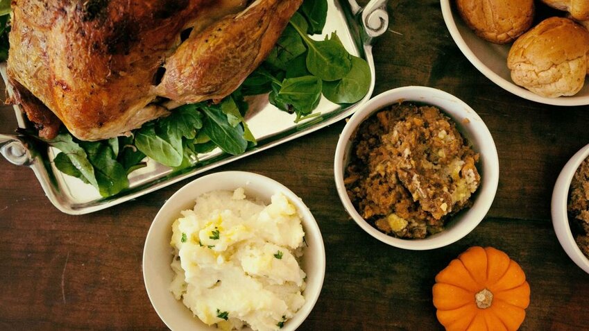A Thanksgiving meal of roast turkey, mashed potatoes and stuffing.