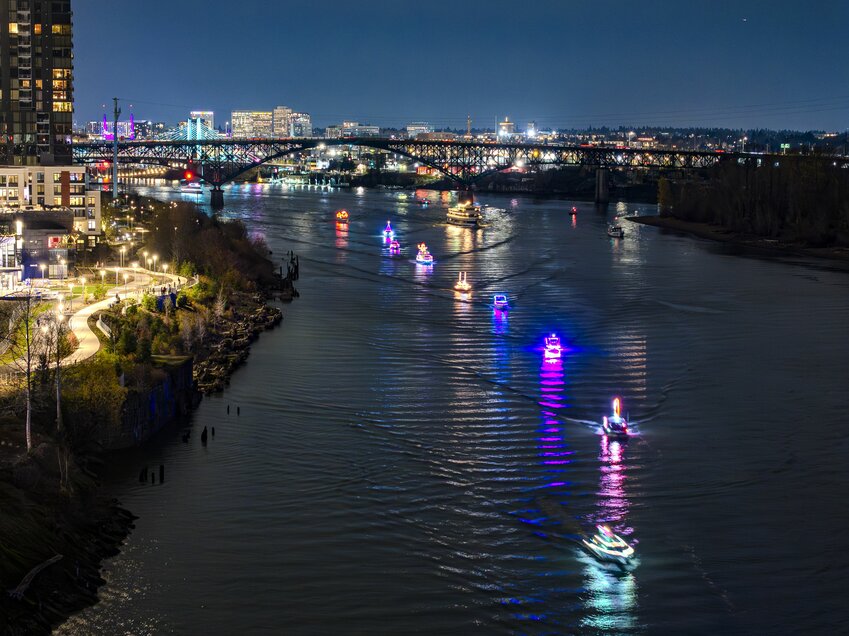 Glittering ships light the Columbia River during the annual Christmas Ships Parade, an Oregon Heritage Tradition established in 1954.