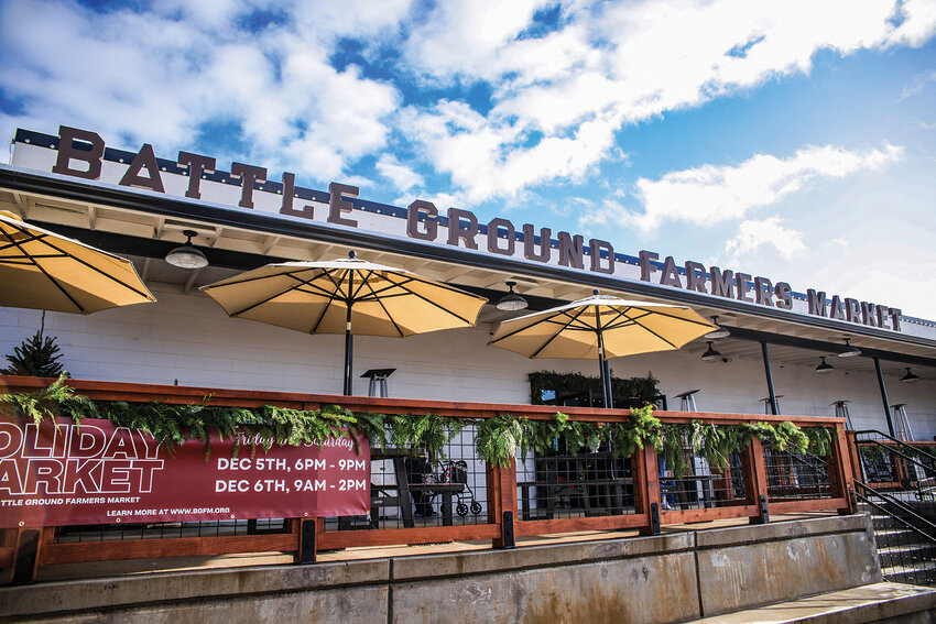 The outside of the Battle Ground Farmers Market is decorated in garland to celebrate the first holiday market on Saturday, Dec. 6, after a night-time market on Friday, Dec. 5.