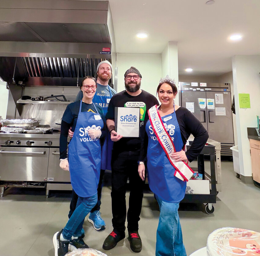 Mrs. Clark County America Jillyn Outlaw, right, volunteered to help provide Thanksgiving dinners with SHARE Vancouver.