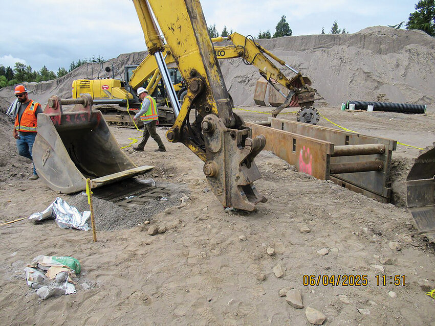This L&amp;I photo taken one day after a trench worker was injured in June at a Woodland job site shows the excavator bucket that came unlatched from the excavator arm quick coupler. The photos, released by L&amp;I on Dec. 3, follow a roughly $170,000 citation which includes claims that the excavator's quick coupler was missing a vital safety latch.