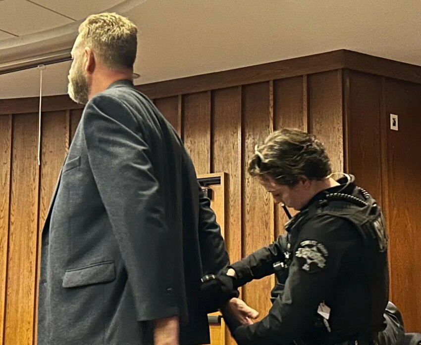 Daren Dean Bowlby, 59, of Castle Rock is handcuffed after being sentenced Wednesday, Dec. 3 in Kelso to over 7 1/2 years in prison for vehicular homicide.