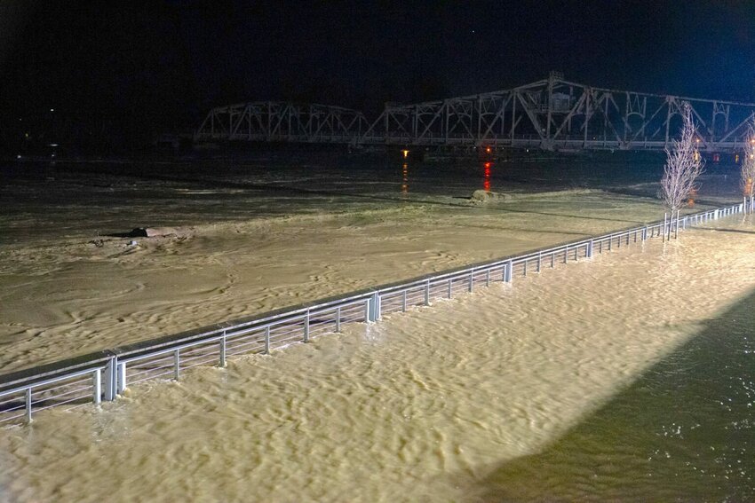 The Skagit River in Mount Vernon hits a record high at 9 p.m. on Thursday night. One Mount Vernon police officer said the water level had climbed almost a foot in an hour. (Photo by Eli Voorhies for Washington State Standard)