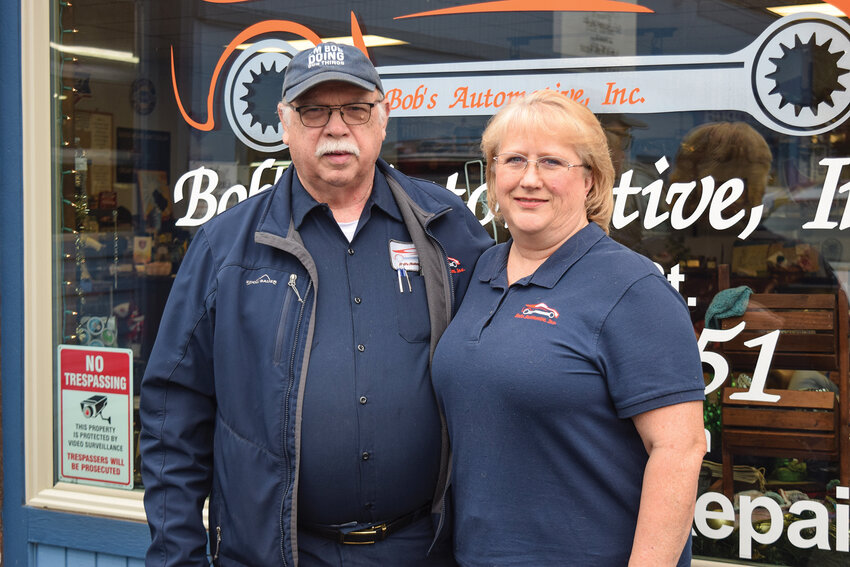 Bob and Priscilla Ford stand in front of Bob&rsquo;s Automotive in downtown Ridgefield Thursday, Dec. 11. The couple will retire after more than 31 years and transfer ownership of the shop on Jan. 1.
