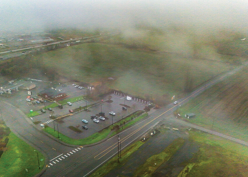 The site of a proposed commercial project dubbed &ldquo;Kirkland Center at Ridgefield&rdquo; is seen through the clouds between North 65th Avenue and Interstate 5 on Friday, Dec. 12. The project is slated to include a large home improvement store and two possible mixed-use buildings.