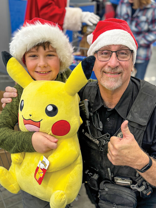 Local children shopped for holiday gifts and necessities alongside officers from the Battle Ground Police Department during the annual Shop with a Cop event.