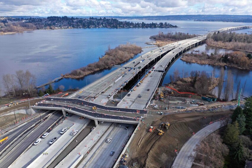 An aerial view in February 2024 of work on a new bike and pedestrian bridge over State Route 520 and connecting trails north and south of the highway. (Washington State Department of Transportation)