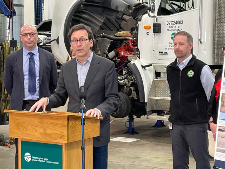Washington Gov. Bob Ferguson on Friday discusses his plan to invest $3 billion in highway preservation, bridge maintenance and ferry building in the next decade. The news conference took place at the state Department of Transportation facility in Lacey, Washington. (Photo by Jerry Cornfield/Washington State Standard)