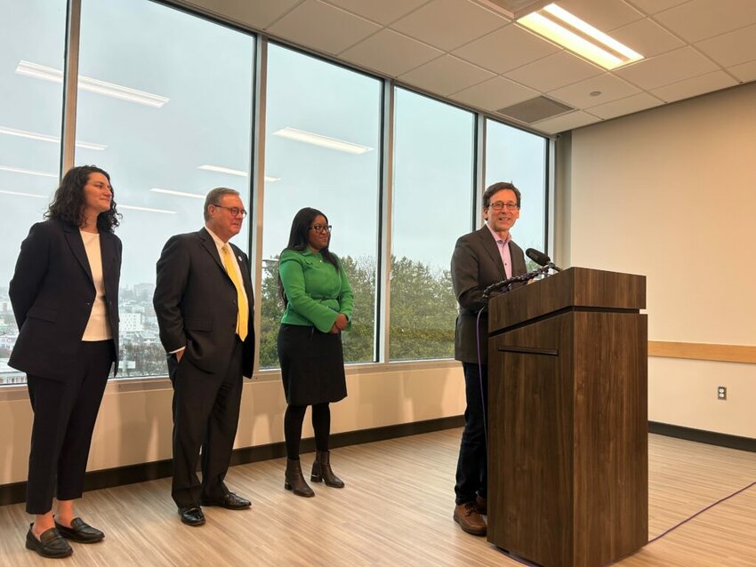 Washington Gov. Bob Ferguson announces proposed housing investments in a press conference in Seattle, alongside, from left to right, state Sen. Emily Alvarado, Lt. Gov. Denny Heck and Housing Development Consortium Executive Director Patience Malaba on Thursday, Dec. 18, 2025. (Photo by Jake Goldstein-Street/Washington State Standard)