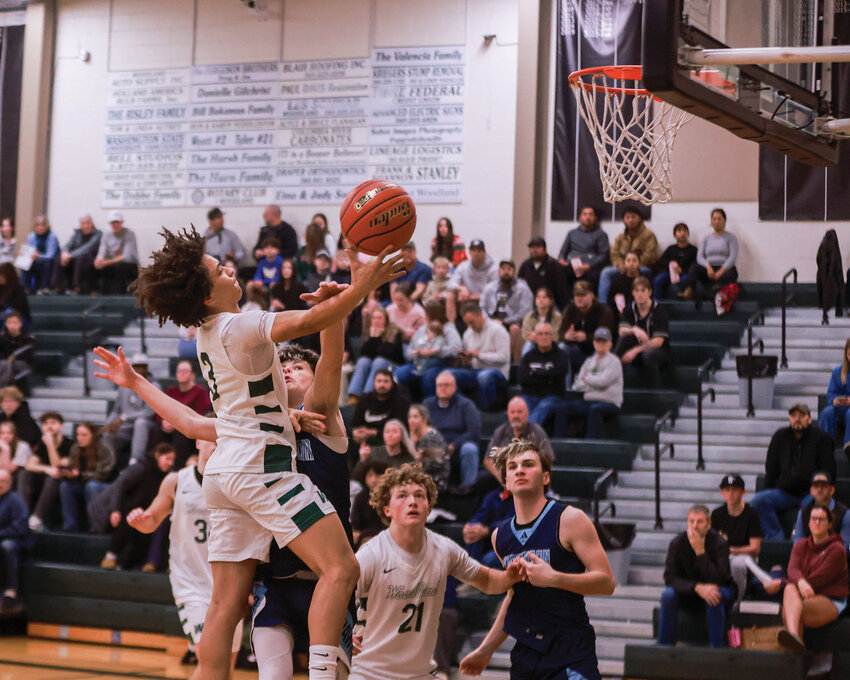Woodland sophomore Dyrian McPoland makes a layup in the Beavers&rsquo; 72-49 win over the Hockinson Hawks on Wednesday, Dec. 17.