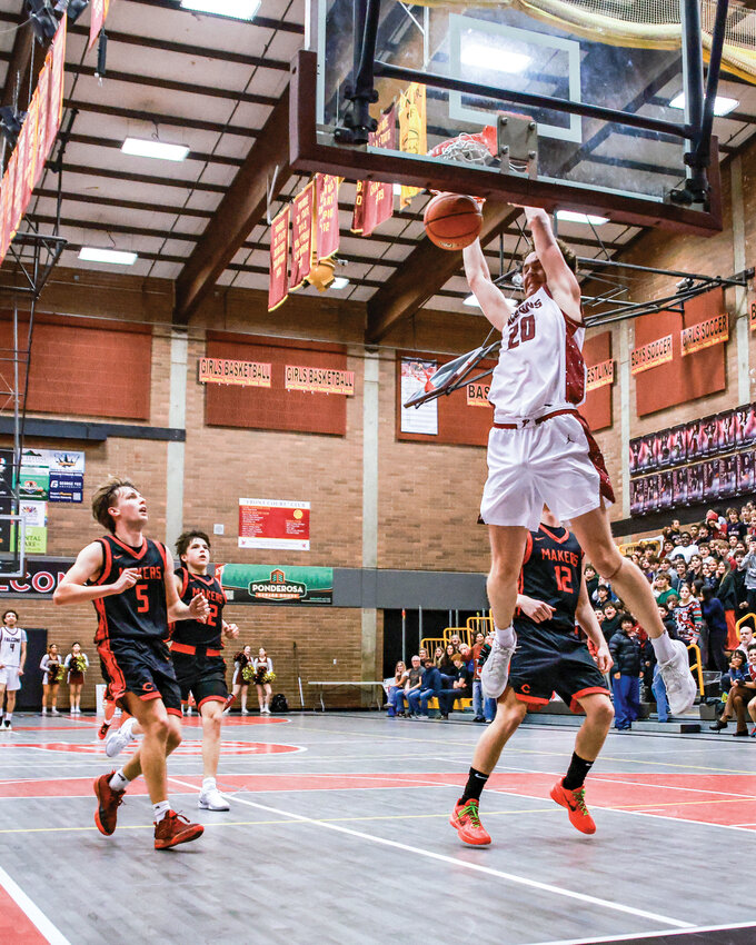 Prairie senior forward Carson Morningstar slams down a dunk in the Falcons&rsquo; 60-58 win over the Camas Papermakers on Thursday, Dec. 18.