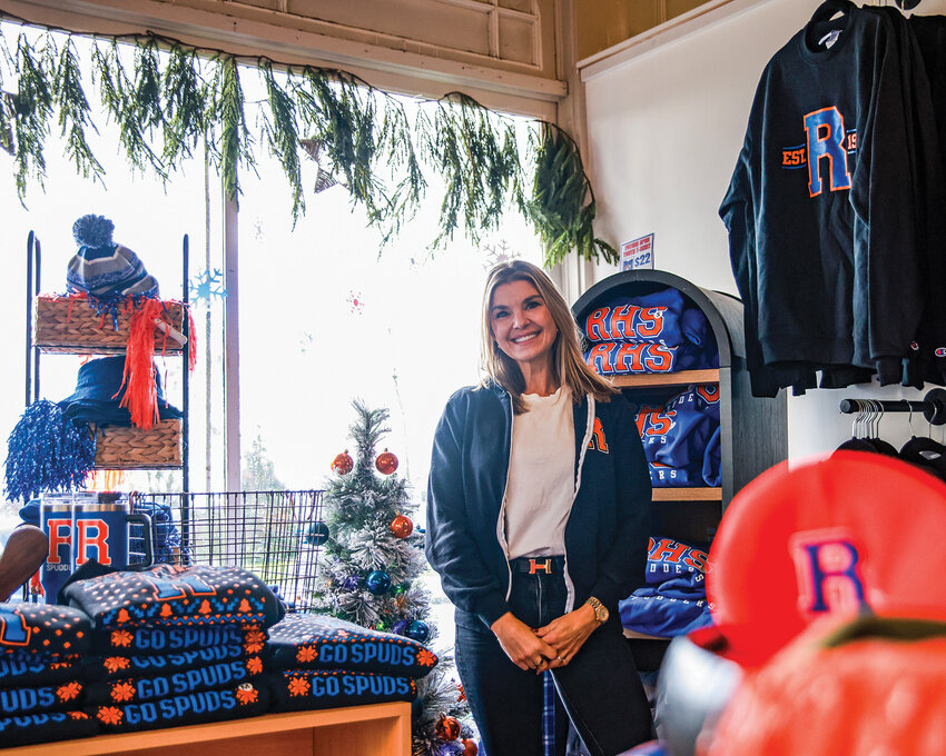 Rebecca Rorabaugh stands in the brand new Spudder Spirit and Co. merch store inside Ridgefield Floral and Gift at the corner of North Main Avenue and Pioneer Street on Wednesday, Dec. 17.