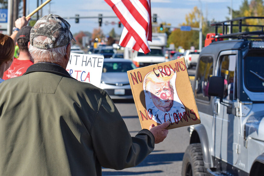 A protester holds a sign reading &ldquo;No Crowns, No Clowns&rdquo; at the intersection of state Route 502 and state Route 503 in Battle Ground on Saturday, Oct. 18. The &ldquo;No Kings&rdquo; demonstration&rsquo;s turnout inspired the formation of the new Indivisible North Clark County chapter.