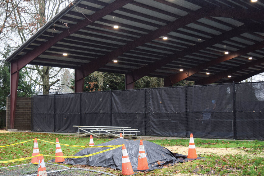 A sound wall lines the south side of the Kiwanis Park pickleball courts in Battle Ground. A recent noise study recommends adding hanging acoustic curtains above the wall and along fencing to further reduce noise reaching nearby homes.