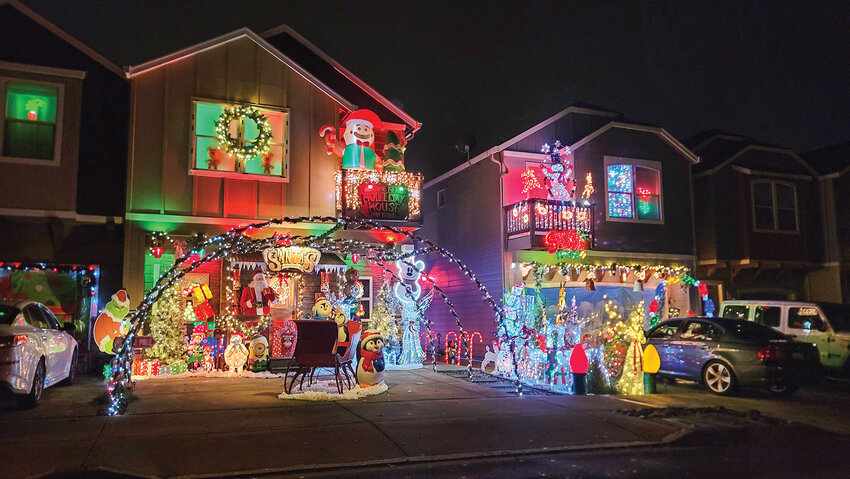 Neighboring houses light up the night at Ridgefield&rsquo;s Candy Cane Lane neighborhood located on the northwest side of the North 35th Avenue and Pioneer Street intersection.