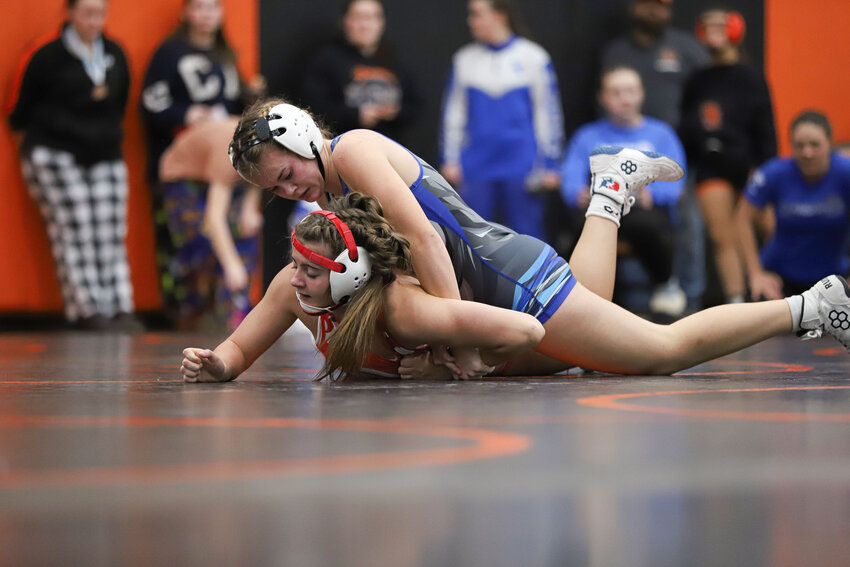 La Center's Bostyn Taylor wrestles Castle Rock's Audrie Longwell during the 130-pound finals at the Lady Mountaineer Invitational at Rainier High School on Saturday, Dec. 20.