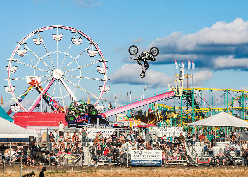 A big-air motocross freestyle rider performs a backflip ahead of the 7 p.m. side-by-side racing show at the Clark County Fair Grandstands on Thursday, Aug. 7.