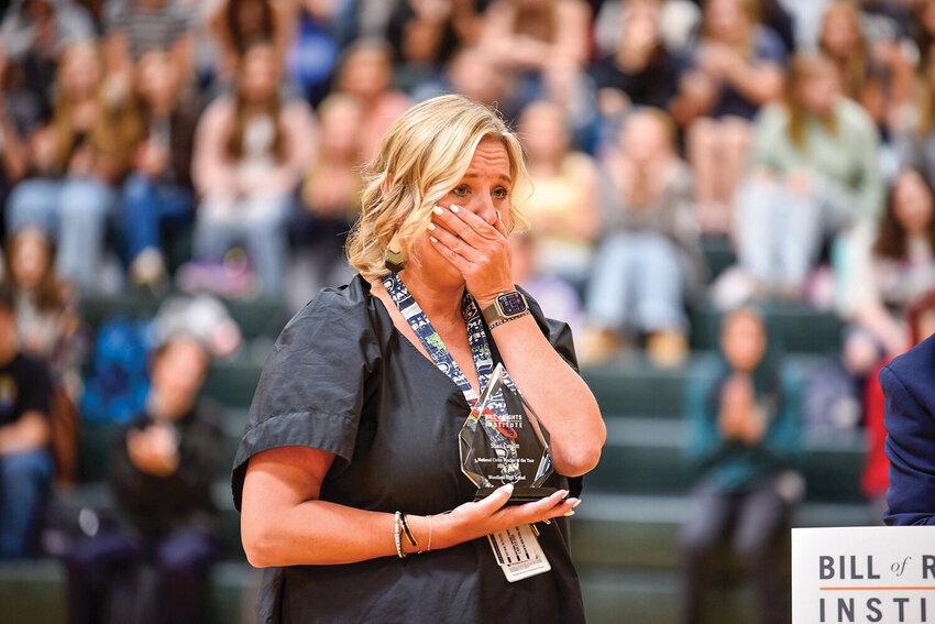Woodland High School Social Studies teacher Shari Conditt was surprised to receive The Bill of Rights Institute's National Civics Teacher of the Year trophy, presented to her during a special assembly on Sept. 10, 2024. Conditt, who has received many awards for her civics teaching over the years, was recently appointed to the Washington State Board of Education by Governor Bob Ferguson.