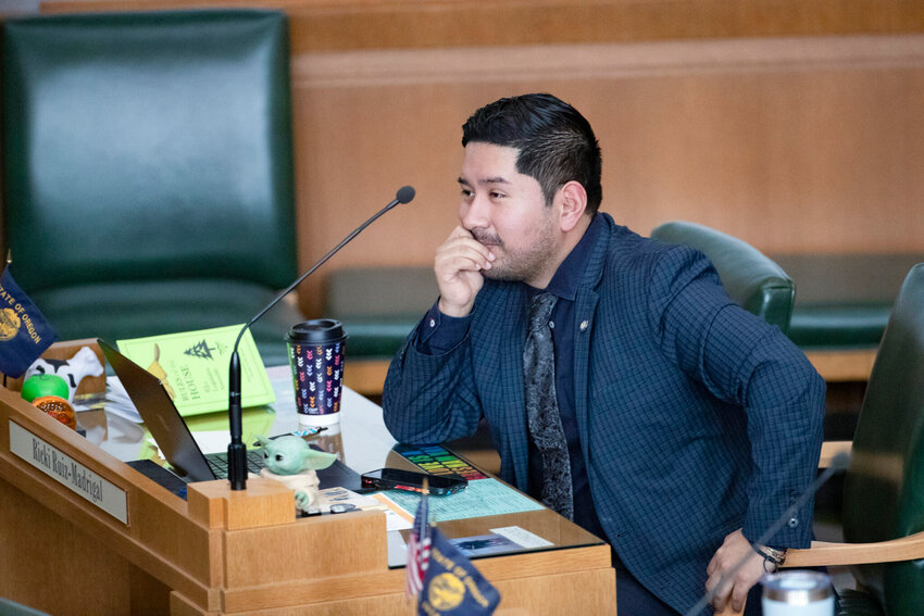 Rep. Ricki Ruiz, D-Gresham, works on the House floor at the Oregon Capitol in Salem on Tuesday, Feb. 28, 2023. (Photo by Amanda Loman/Oregon Capital Chronicle)