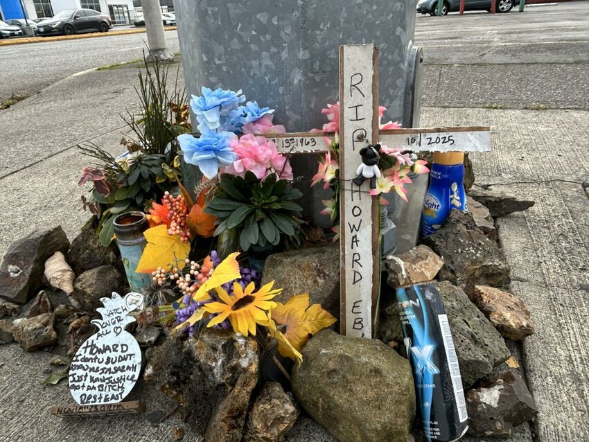 A makeshift memorial for Howard K. Eby is seen on Saturday, Nov. 22 in Longview, at the corner of 11th Avenue and Washington Way, the site. Police say that was the location Eby was fatally struck in October 2025.