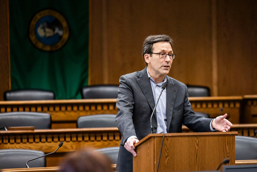Gov. Bob Ferguson answers questions from the press during a legislative session preview in a Senate Hearing room in Olympia on Friday, Jan. 9.