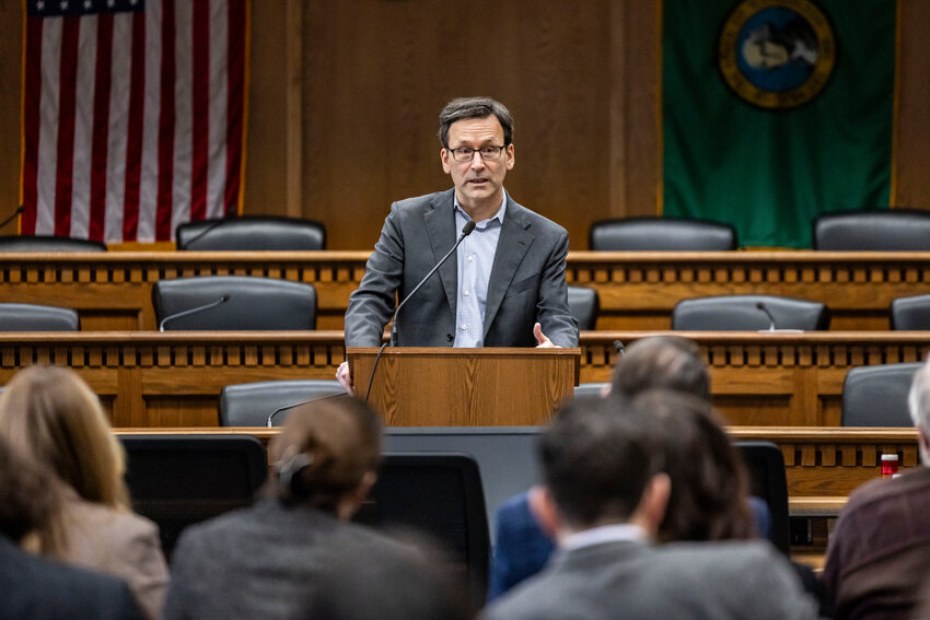 Gov. Bob Ferguson answers questions from the press during a legislative session preview in a Senate Hearing room in Olympia on Friday, Jan. 9.