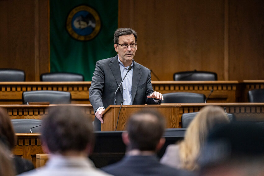 Gov. Bob Ferguson answers questions from the press during a legislative session preview in a Senate Hearing room in Olympia on Friday, Jan. 9.