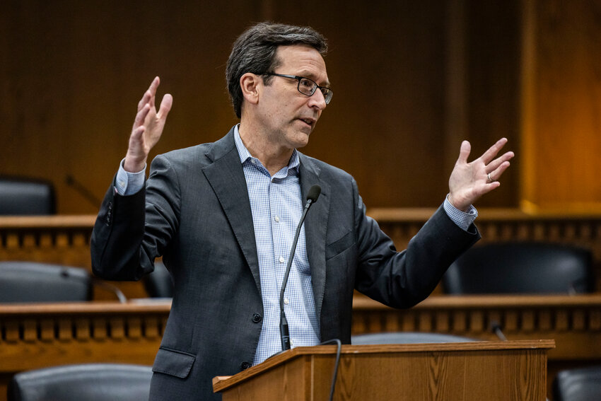 Gov. Bob Ferguson answers questions from the press during a legislative session preview in a Senate Hearing room in Olympia on Friday, Jan. 9.