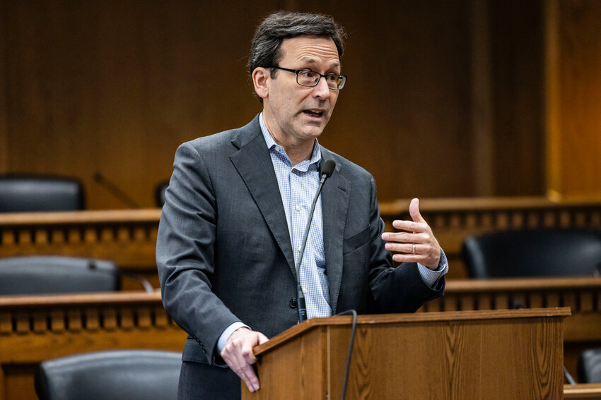 Gov. Bob Ferguson answers questions from the press during a legislative session preview in a Senate Hearing room in Olympia on Friday, Jan. 9.