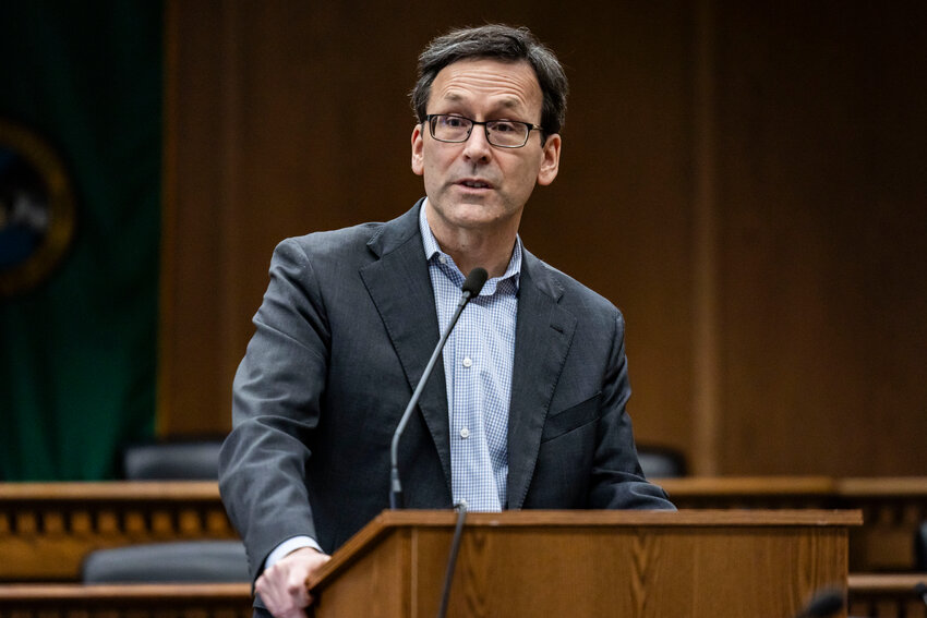 Gov. Bob Ferguson answers questions from the press during a legislative session preview in a Senate Hearing room in Olympia on Friday, Jan. 9.