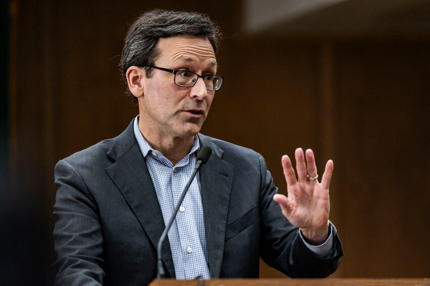 Gov. Bob Ferguson answers questions from the press during a legislative session preview in a Senate Hearing room in Olympia on Friday, Jan. 9.