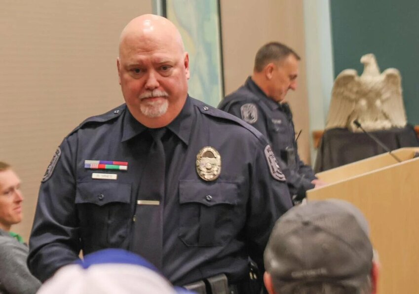 Retired Kelso Police Officer Ralph Hines walks away from the podium on Tuesday, Jan. 6 after accepting his retired police officer badge and ID card at Kelso City Hall. Hines worked for the department for 22 years