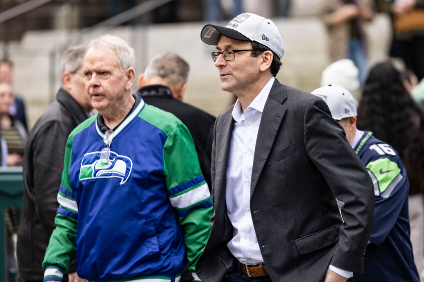 Gov. Bob Ferguson walks up to a &ldquo;12&rdquo; flag raising ceremony ahead of this Saturday&rsquo;s playoff game against the San Francisco 49ers at the state capitol in Olympia on Wednesday, Jan. 14.