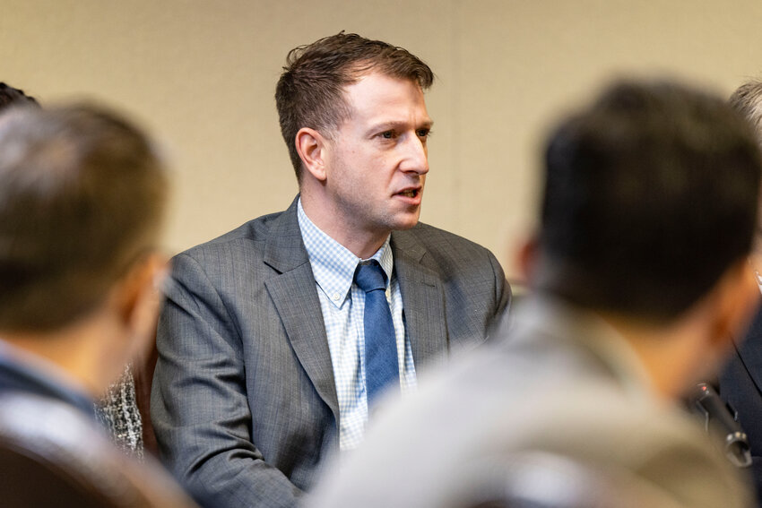Rep. Joe Fitzgibbon answers a question from the press before Gov. Bob Ferguson gives his State of the State address at the Washington state Capitol in Olympia on Tuesday, Jan. 13.