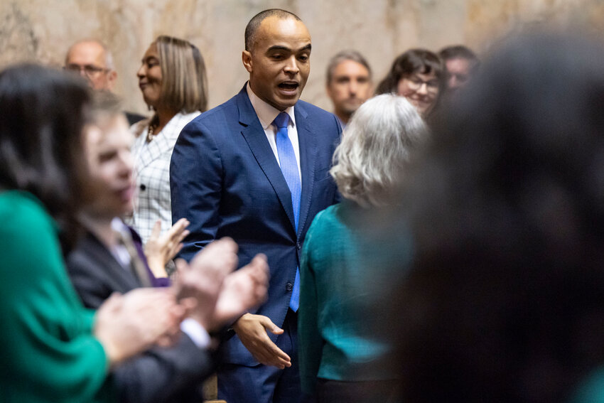 Attorney General Nick Brown greets legislators in the House chambers at the Washington state Capitol in Olympia on Tuesday, Jan. 13.