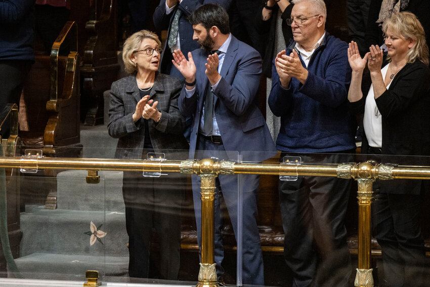 Former Washington Gov. Christine Gregoire, far left, applauds after Gov. Bob Ferguson gave the State of the State address at the Washington state Capitol in Olympia on Tuesday, Jan. 13.