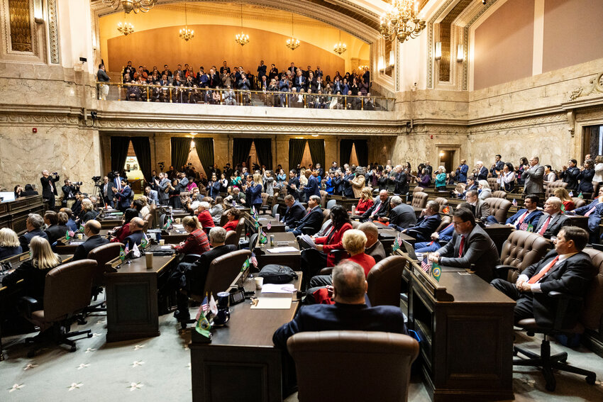 Legislators and attendees in the gallery above the House chamber listen as Gov. Bob Ferguson delivers the State of the State address in Olympia on Tuesday, Jan. 13.