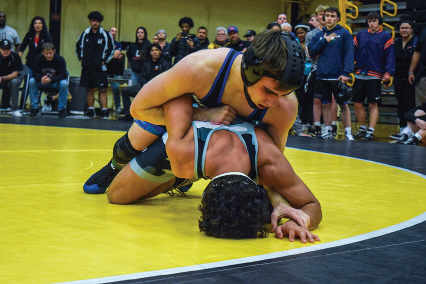 Jonas DesRochers pins Union&rsquo;s Nehem&iacute;as Rodriguez Troche during the 132-pound championship match. DesRochers won the bout 18-1 to claim first place at the Norm Friehauf Clark County Championships on Jan. 18.