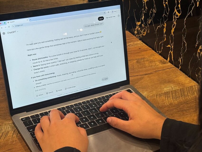 A young woman asks AI companion ChatGPT for help this month in New York City. States are pushing to prevent the use of artificially intelligent chatbots in mental health to try to protect vulnerable users. (Photo by Shalina Chatlani/Stateline)